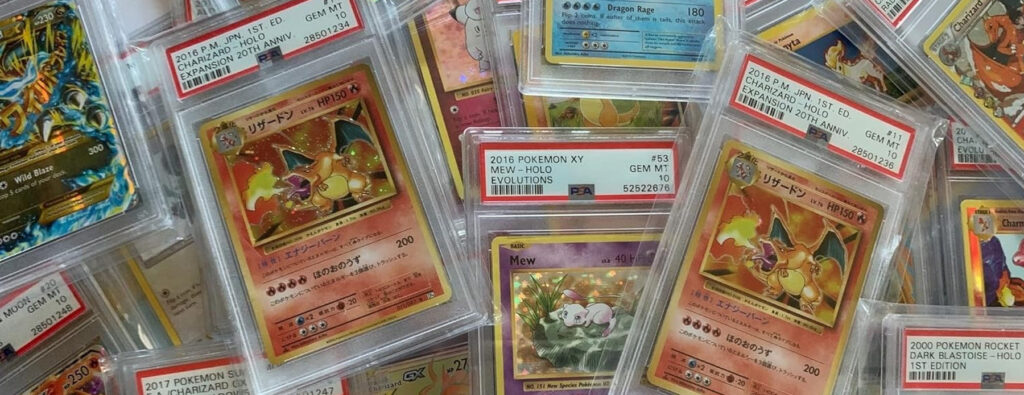 PSA-graded cards scattered on a table