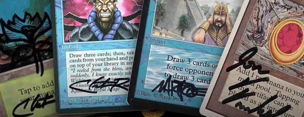 Four autographed trading cards.